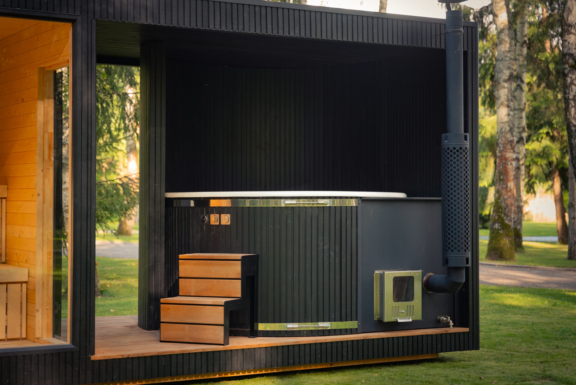 Tauras 2×1 sauna with hot tub by Celsium set within a calm forest landscape