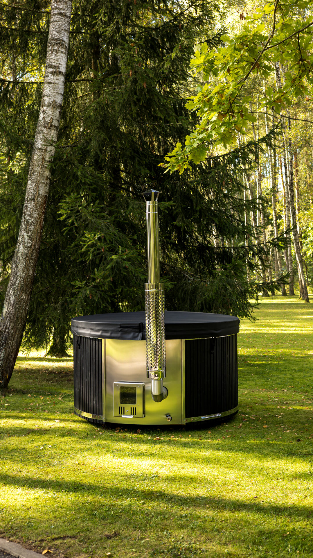 Benas hot tub by Celsium set within a calm forest landscape